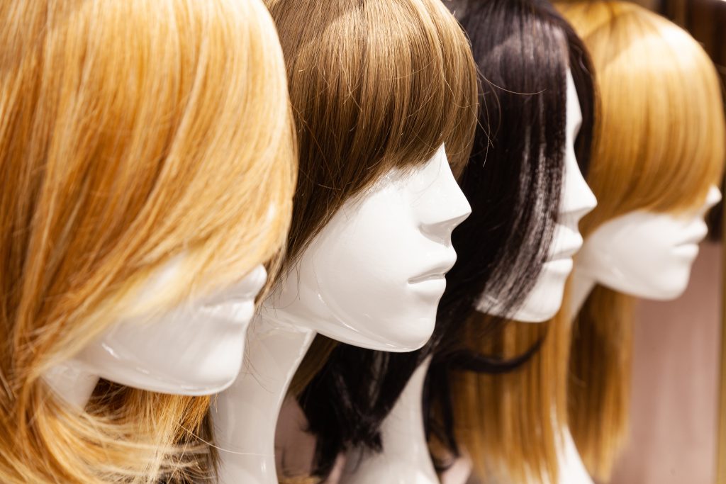 Multi colored,Wigs,Are,Worn,On,The,Heads,Of,Mannequins.